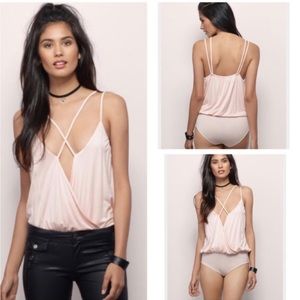 Pink criss cross bodysuit